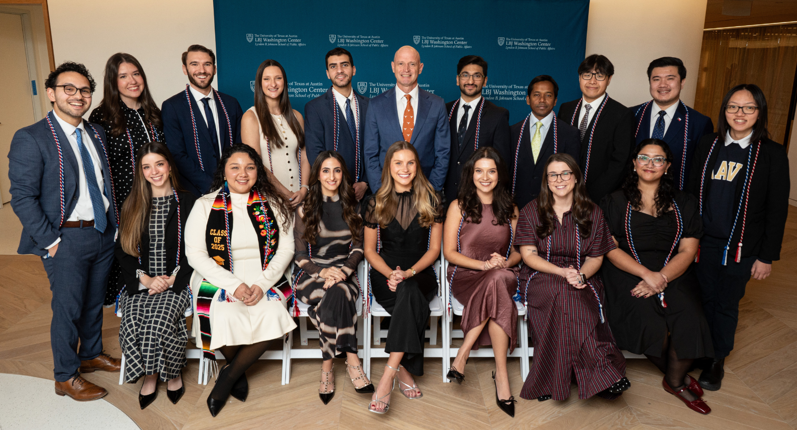 17 graduates and the LBJ School Dean in 2 rows