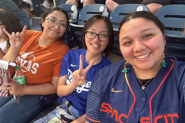 3 students at a baseball game